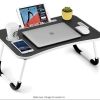 Injection moulded folding table with cup holder